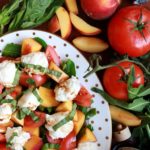 peach and burrata salad with tomatoes and greens