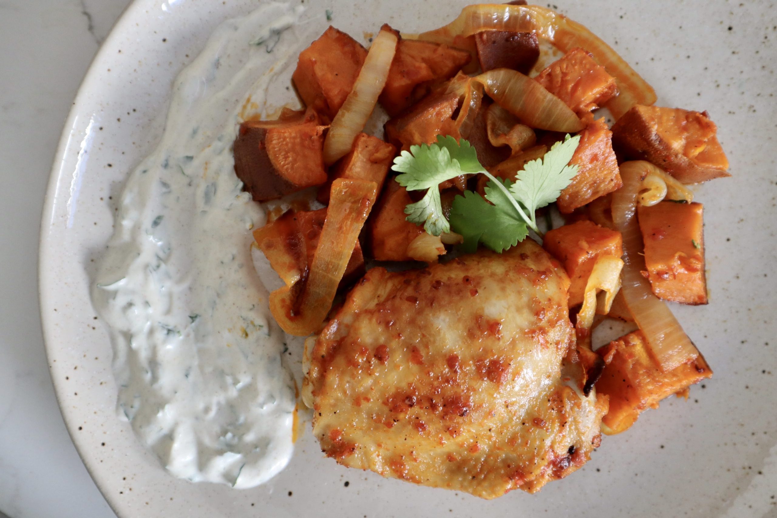 sheet pan harissa chicken with sweet potatoes and yogurt sauce